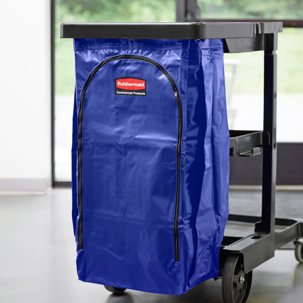 A blue Rubbermaid high capacity vinyl bag on a cart.