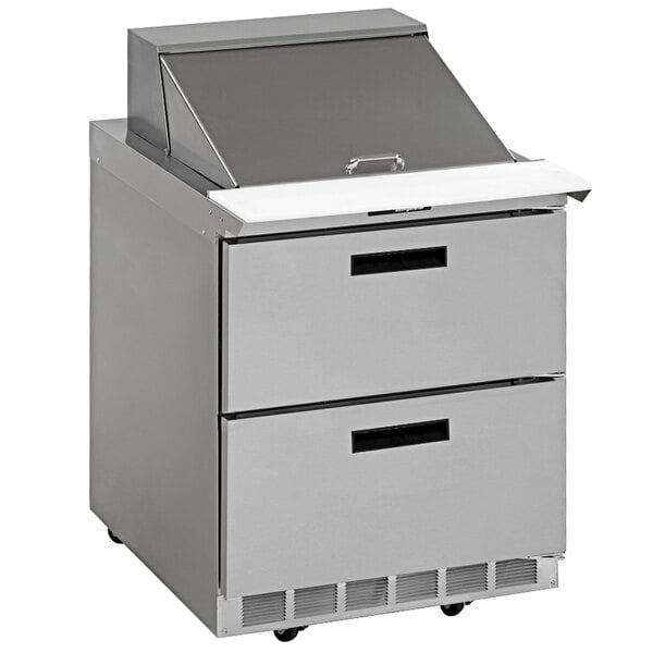 A stainless steel Delfield 2 drawer refrigerated sandwich prep table on wheels.
