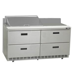 A stainless steel Delfield refrigerated sandwich prep table with drawers.