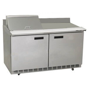 A stainless steel Delfield refrigerator with two doors and a white rectangular top.
