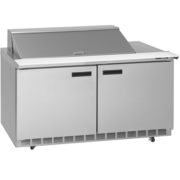 A stainless steel Delfield refrigerator with two doors on a counter.