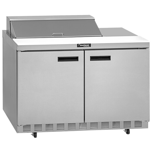 A Delfield stainless steel 2 door refrigerator on a counter.