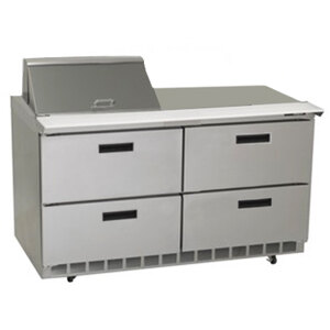 A stainless steel Delfield refrigerator with four drawers.