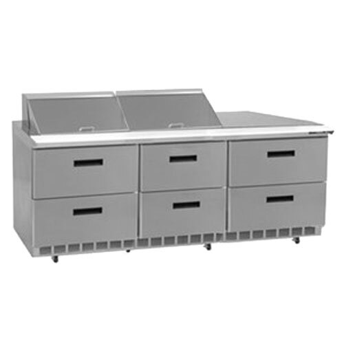 A Delfield stainless steel refrigerator with 6 drawers on a counter.