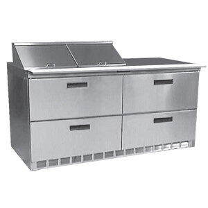 A Delfield stainless steel commercial sandwich prep table with 4 drawers.