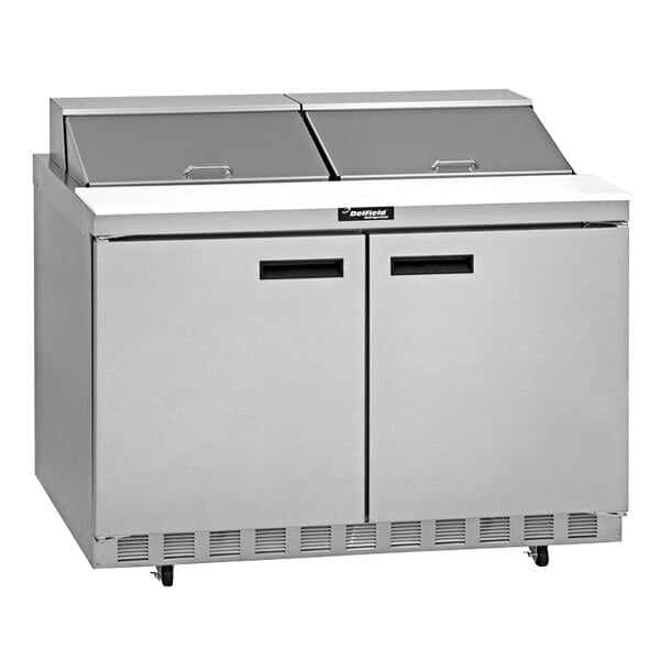 A Delfield stainless steel sandwich prep table with two doors.