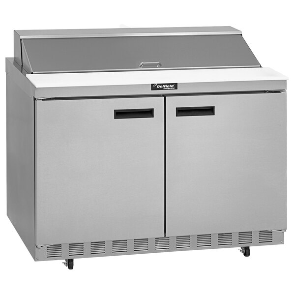 A stainless steel Delfield 48" 2 door refrigerator on a counter.