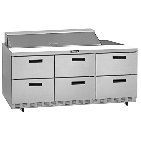 A stainless steel Delfield refrigerated sandwich prep table with drawers.