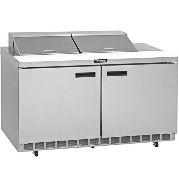 A Delfield stainless steel refrigerated sandwich prep table with two doors.