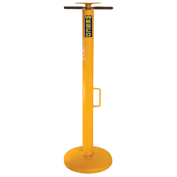 A Wesco yellow metal trailer stabilizing jack with a black base and handle.