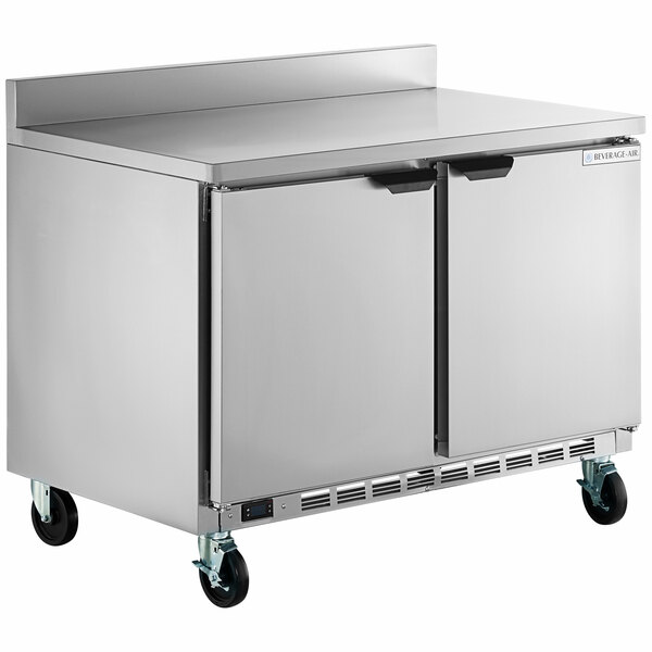 A large stainless steel Beverage-Air worktop freezer with two doors on wheels.