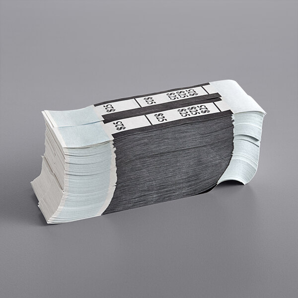 A stack of black self-adhesive currency straps with white numbers on them.