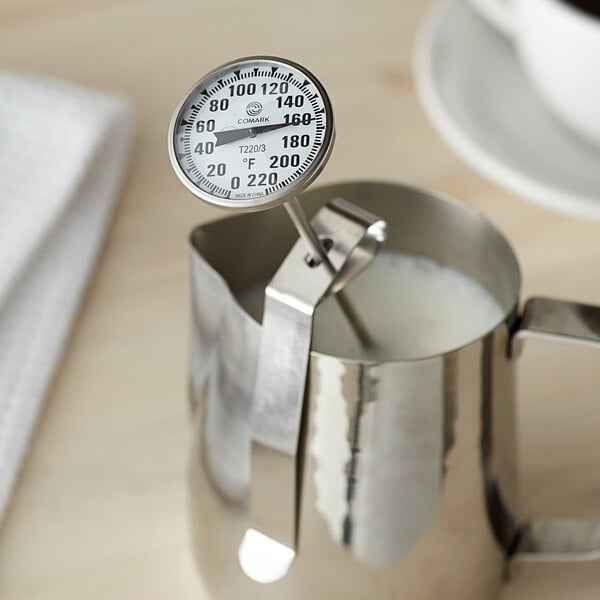 A Comark T220/38A pocket probe thermometer in a pitcher.