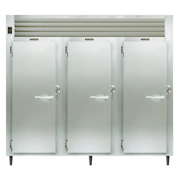 The open doors of a Traulsen three section heated holding cabinet.