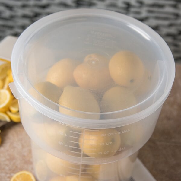 A translucent plastic Carlisle lid on a container of lemons.