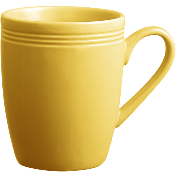 A set of 12 yellow Acopa Capri stoneware mugs with handles.