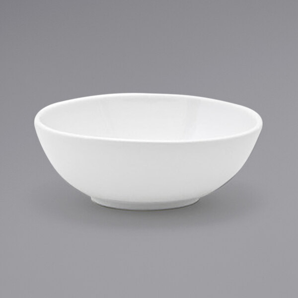 A Front of the House white oval tall porcelain bowl on a gray surface.
