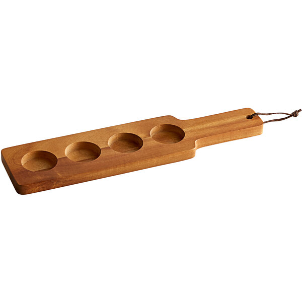 An Anchor Hocking acacia wood paddle with holes in it.