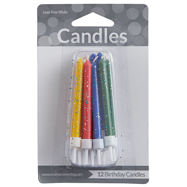 A pack of 12 Creative Converting primary color glitter birthday candles in plastic packaging.