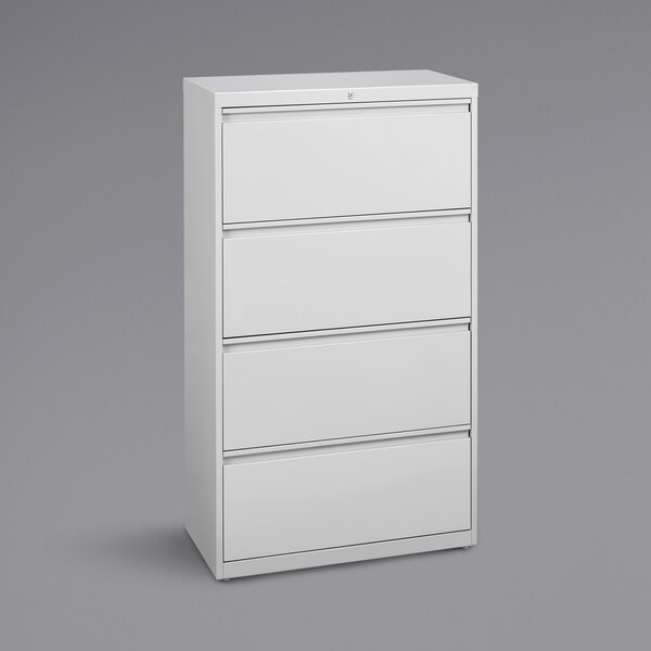 A white Hirsh Industries lateral file cabinet with four drawers.