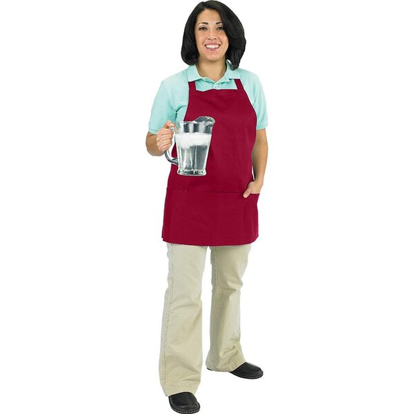 A woman wearing a Chef Revival burgundy apron holding a glass of liquid.