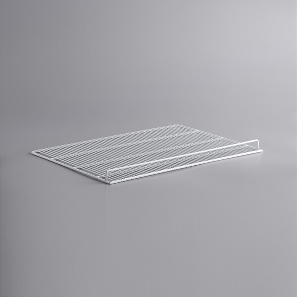 A white metal grid shelf for an Avantco deli case.