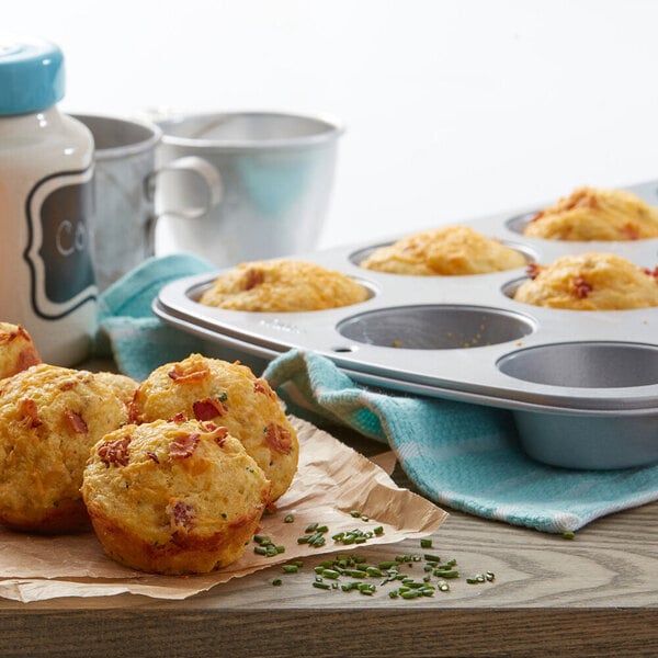 A Wilton non-stick steel muffin pan with muffins on it.