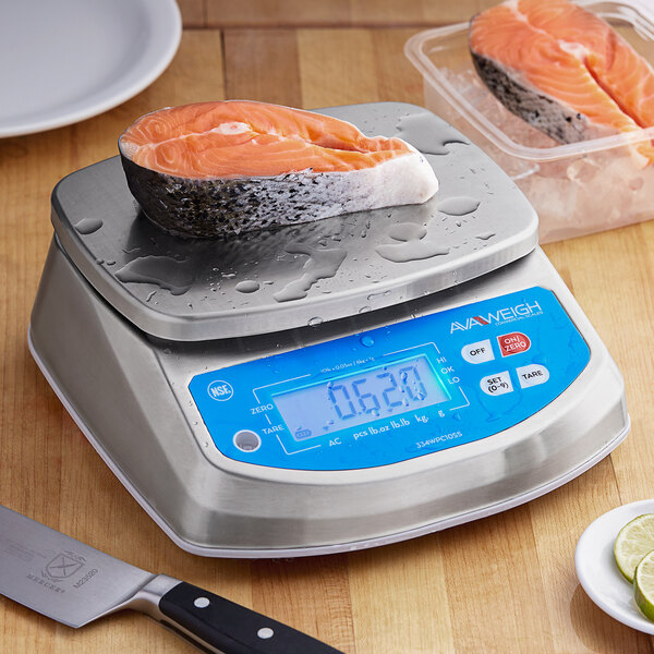 An AvaWeigh digital portion scale with salmon on it.