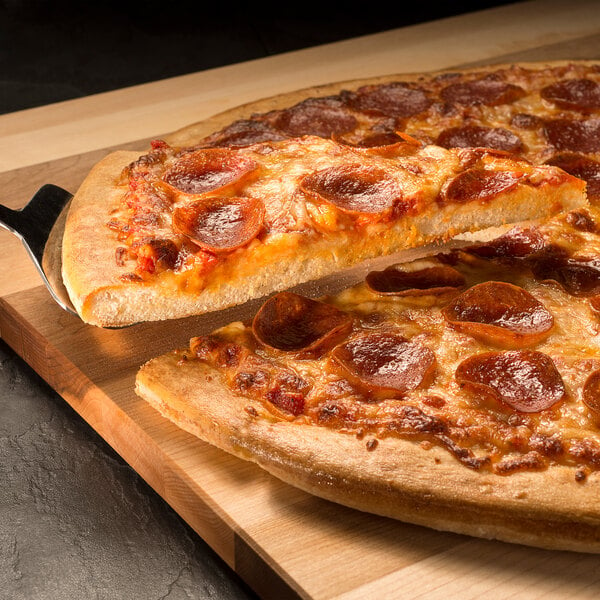 A Rich's pepperoni pizza being cut on a wooden board.