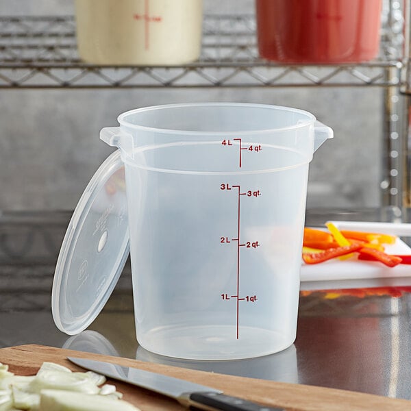 A white Cambro round plastic food storage container with a lid.