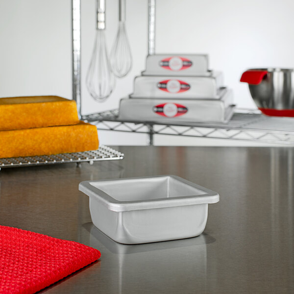 A white rectangular Fat Daddio's cake pan on a kitchen counter.