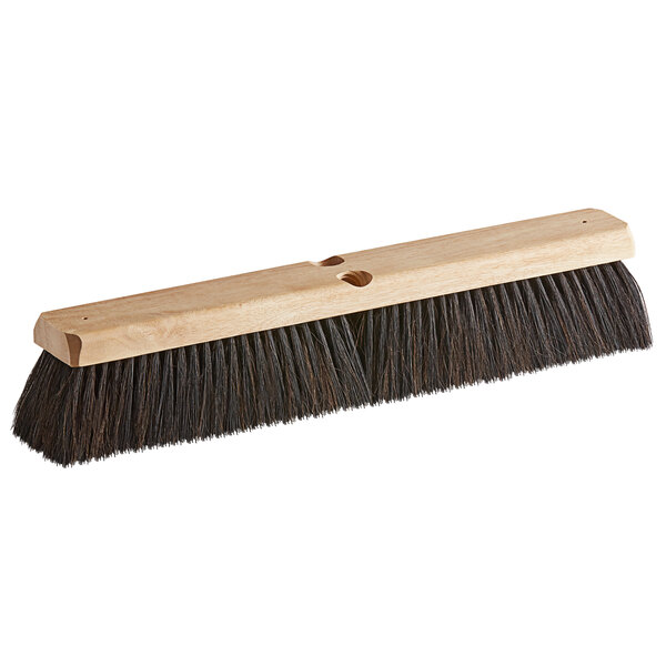 A close-up of a Carlisle hardwood push broom head with a blend of black horsehair and Tampico bristles.