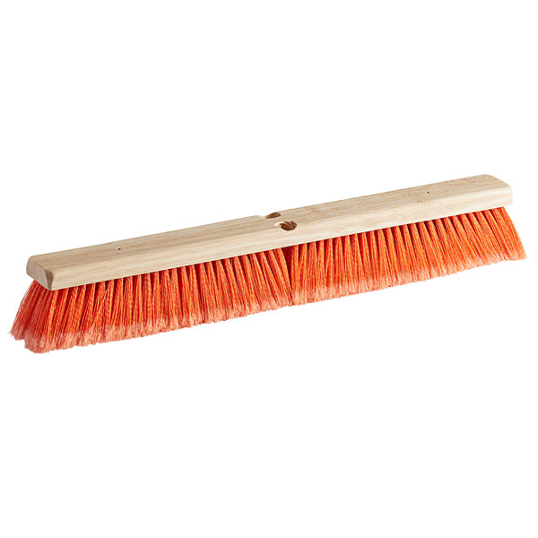 A Carlisle Flo-Pac hardwood push broom head with orange flagged bristles.