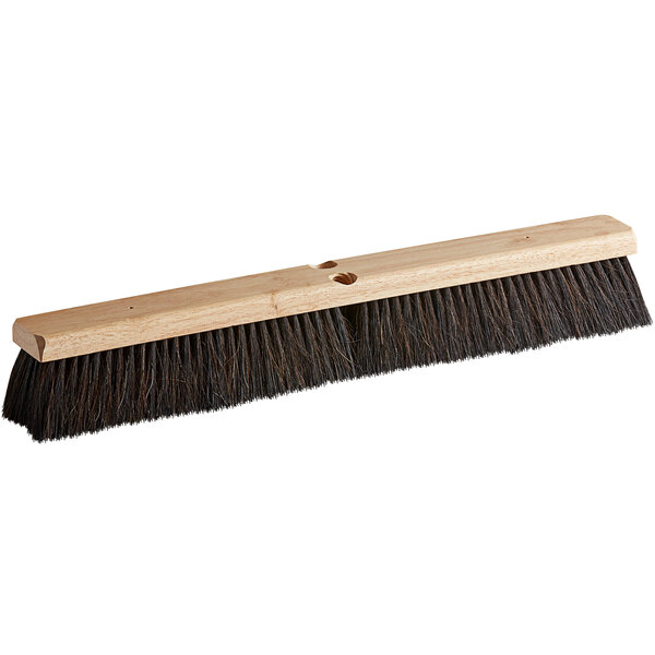 A Carlisle hardwood push broom head with horsehair and polypropylene bristles and a wire center.