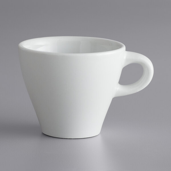 A bright white porcelain espresso cup with a handle.