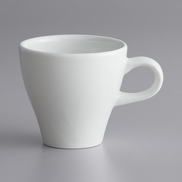 A close-up of a white porcelain Corona cappuccino cup with a handle.