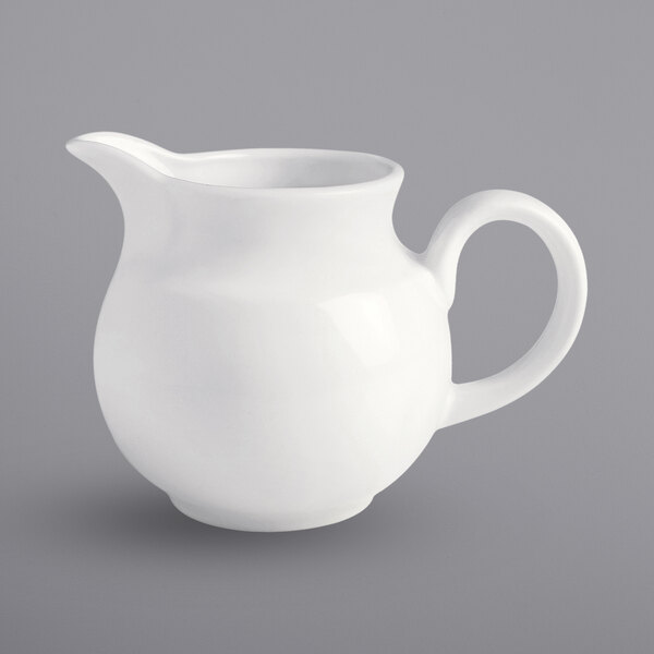 A white Corona by GET Enterprises small stackable porcelain jug with a handle.