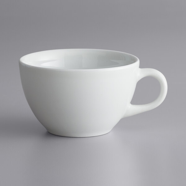 A white Corona by GET Enterprises Actualite tea cup with a handle.