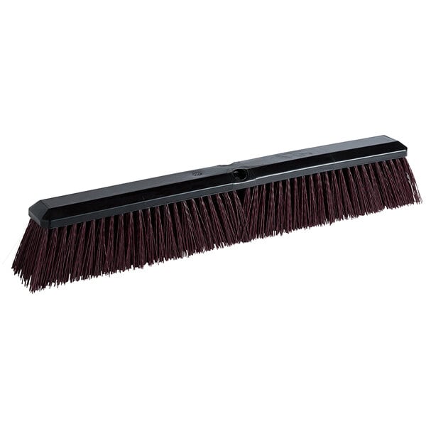 A Carlisle commercial broom head with maroon bristles.