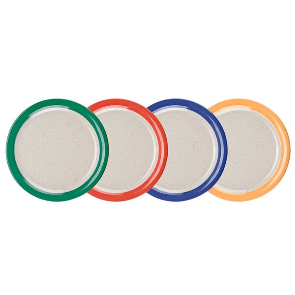 A close-up of a group of GET Diamond Mardi Gras melamine plates with assorted color rims.