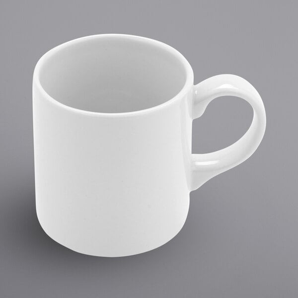 A close up of a white Corona by GET Enterprises Actualite mug with a handle.