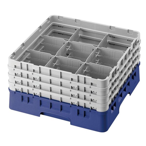 A blue plastic Cambro glass rack with nine compartments and two extenders.