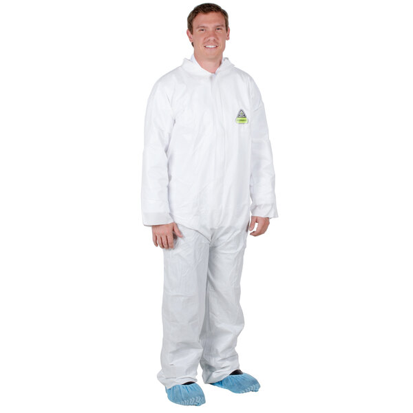 A man wearing Cordova white disposable microporous coveralls.