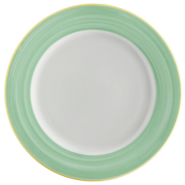 A white porcelain plate with a rolled edge and green and yellow rim.