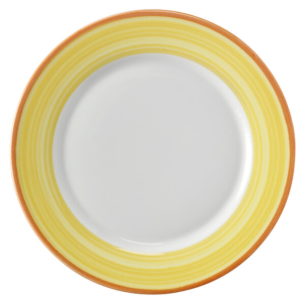 A close-up of a white porcelain plate with yellow and coral rims.
