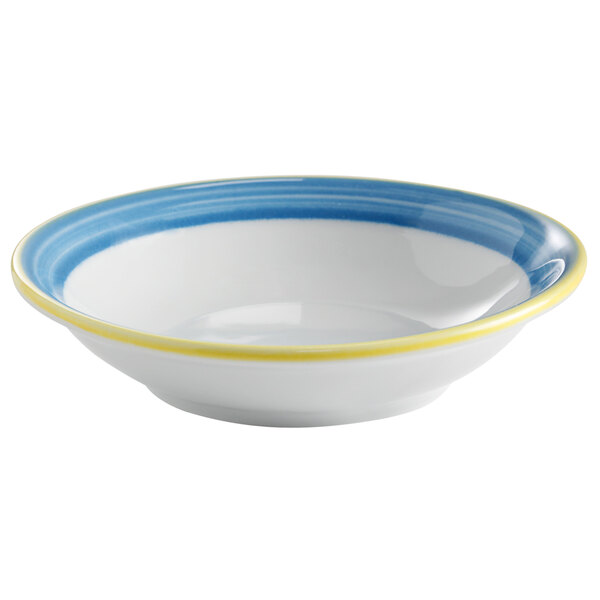 A white bowl with blue and yellow rim.