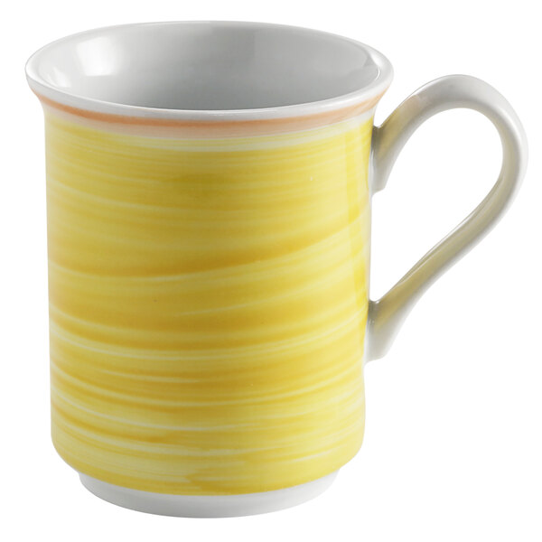 A yellow mug with a white interior and coral rim and handle.