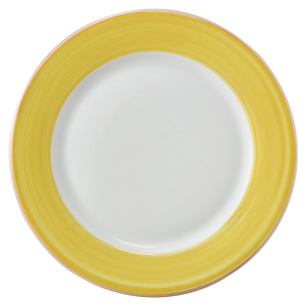 A white porcelain plate with a yellow and coral rim.