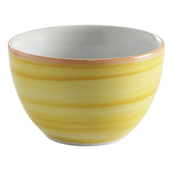 A yellow porcelain bouillon cup with a white rim.