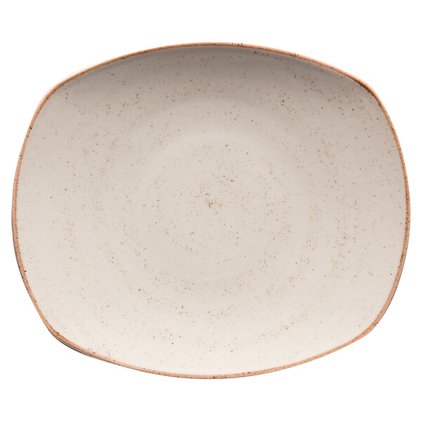 A beige porcelain oval coupe plate with brown speckled edges.